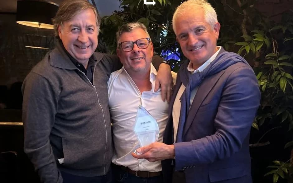 Members of the OnBoard team with the crystal award for Chile at the Annual Convention 2025