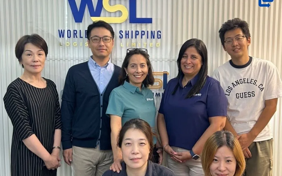 The OnBoard Chile team with the WSL Shipping team in front of the WSL sign