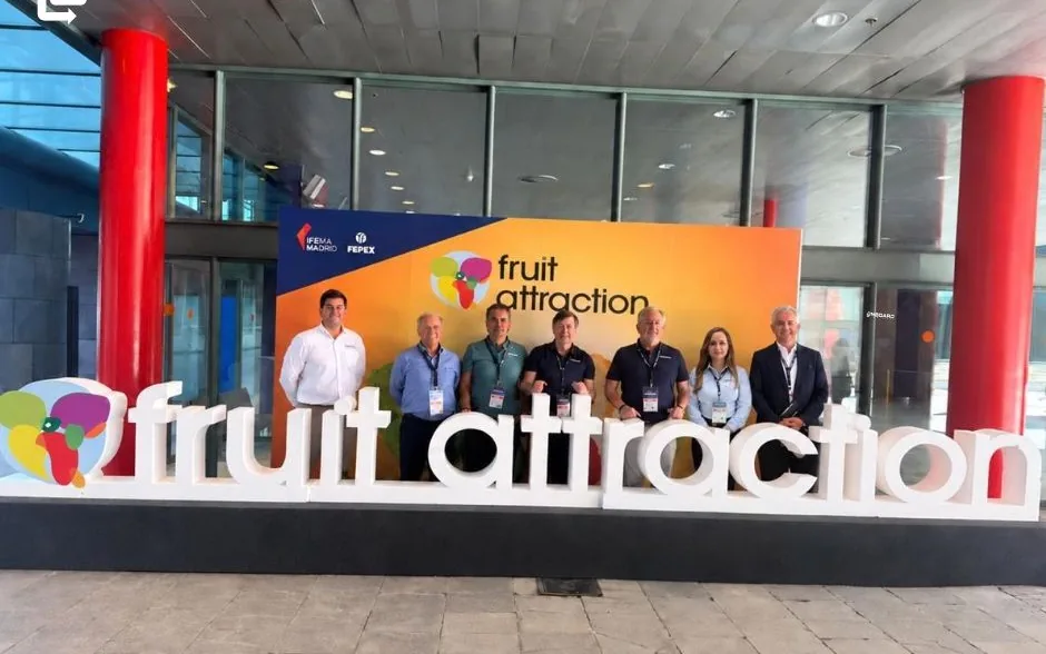 The OnBoard team in front of the large Fruit Attraction sign in Madrid