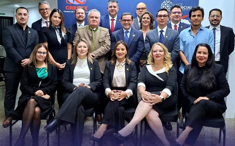 The new CRECEX Board of Directors in a group photo in front of the chamber’s logo