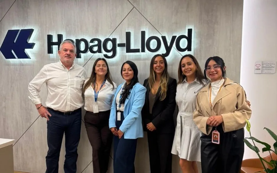 The OnBoard team in front of the Hapag-Lloyd logo at its Bogotá offices