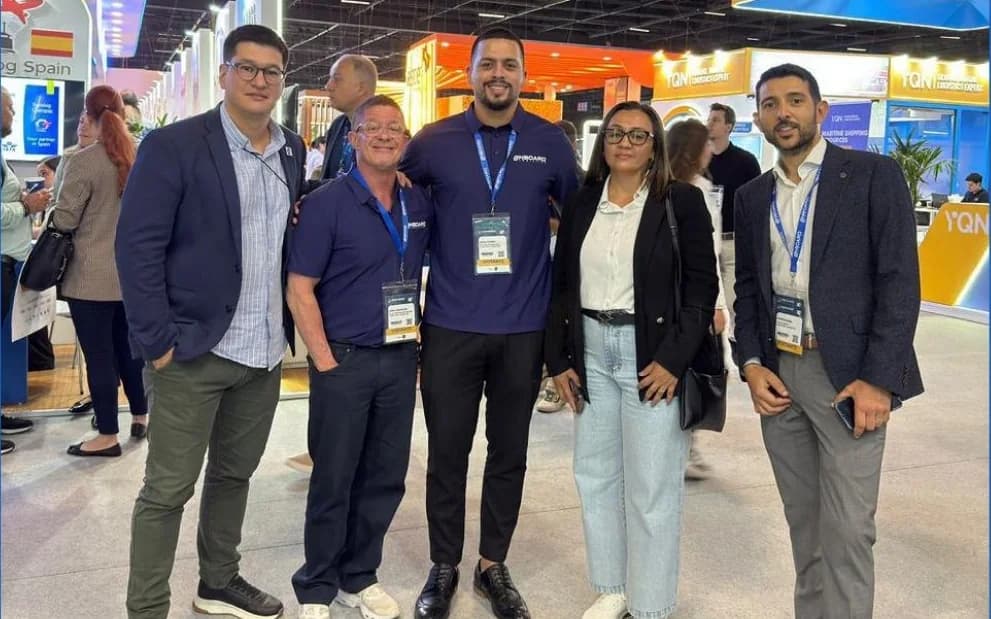 Five members of the OnBoard team in an aisle at Intermodal South America in São Paulo