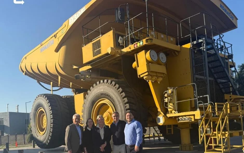 The OnBoard team in front of a Komatsu mining haul truck during the visit in Chile