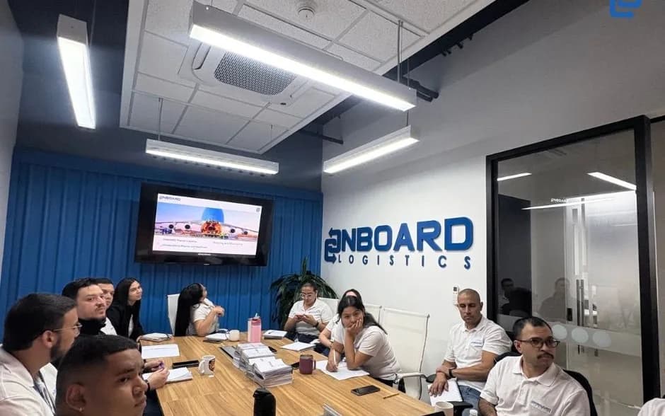 The OnBoard Costa Rica team during the specialized training, in front of the OnBoard Logistics logo