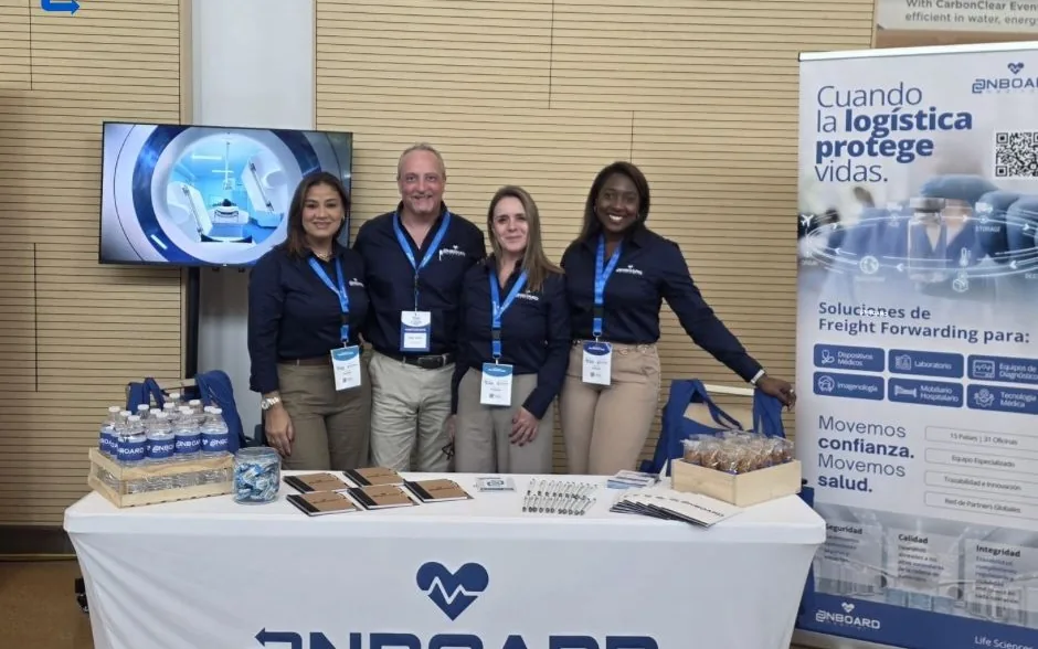 Four members of the OnBoard Medical team at their stand at Summit Medical Devices in Costa Rica